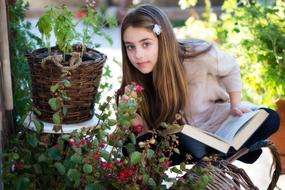 Little Girl flowers and book