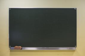a blank board hanging in the classroom