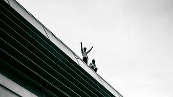 photo of graduates on the roof of the building