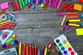 School Times, bright supplies on grey wooden desk