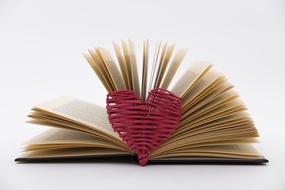 scrolled book and heart