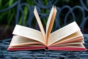 open book on a table in the garden