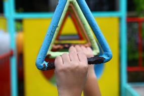 photo of the hands of a child on a children's simulator