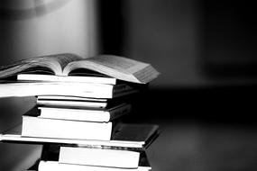 stack of books to read in monochrome