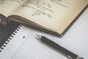 Educational mathematic book and Paper and pen