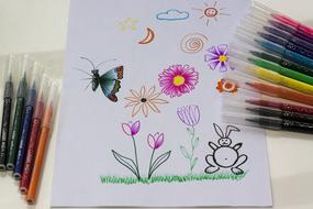 children drawing with felt pens