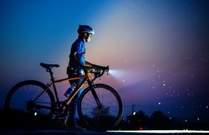 cyclist lighting his way