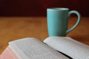 Bible and turquoise cup
