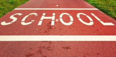 School, white Word on red path among the grass