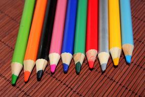 multicolored pencils lie on the table