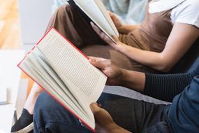 man and woman Reading Books