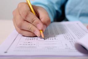 student fills an examination form