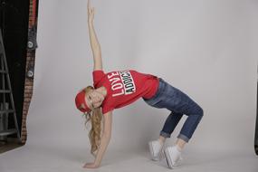 girl dancing break dance in a photo studio