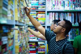 students are looking for books on shelves