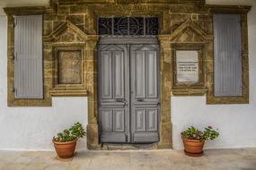 Entrance doors of an old school in the village of Vavla, Cyprus