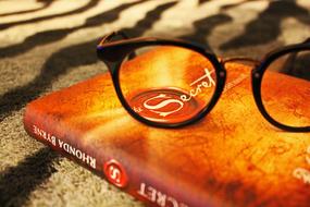 orange book and Glasses