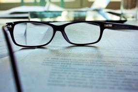 glasses are on the textbook page