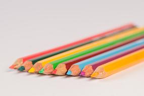 school colored pencils on white table