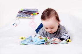 kid with a developmental toy in his hands