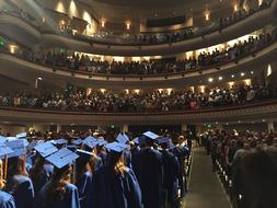 photo of graduates at a festive ceremony