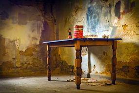 beer on a table in an abandoned building