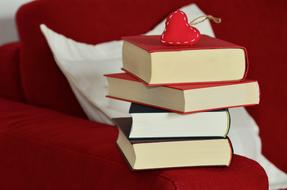 stitched heart on Stack of Books