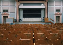 photo of wooden chairs in the classroom at the institute