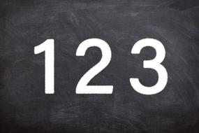 numbers are written on a blackboard