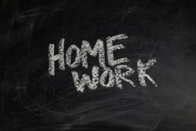 homework text on a blackboard