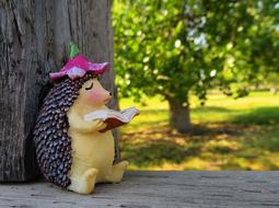 Reading Hedgehog ceramic figurine tree