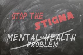 stop the stigma, red writing on black board