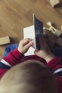 children's book in the hands of a child