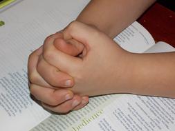 Child Praying Hands and book