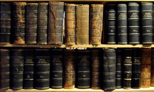 two shelves with old books close up