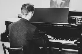 Pianist, young man playing, vintage photo