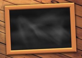 empty blackboard in wooden frame on the wooden surface