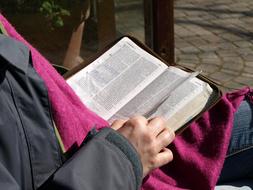 man reading Bible