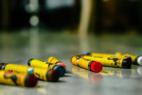 wax crayons lie on a glass table