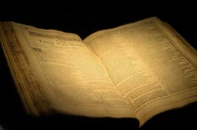 open vintage book with yellow pages
