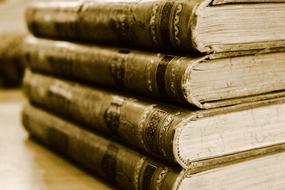 photo of four antique stacked books