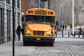 front view of school bus on street, usa, nyc