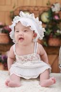 Cute baby in white clothing