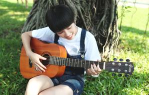 college student with guitar