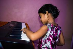 Cute Girl Playing Piano