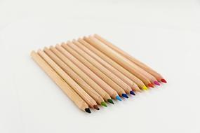 wooden colored pencils on white