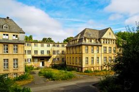 Lost Place, Old multi-story building at summer