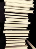 photo of a large stack of university books