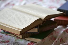 stack of old books to read on the table