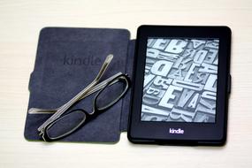 glasses on open e-reader