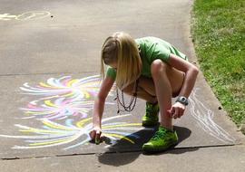 girl drawing with chalk